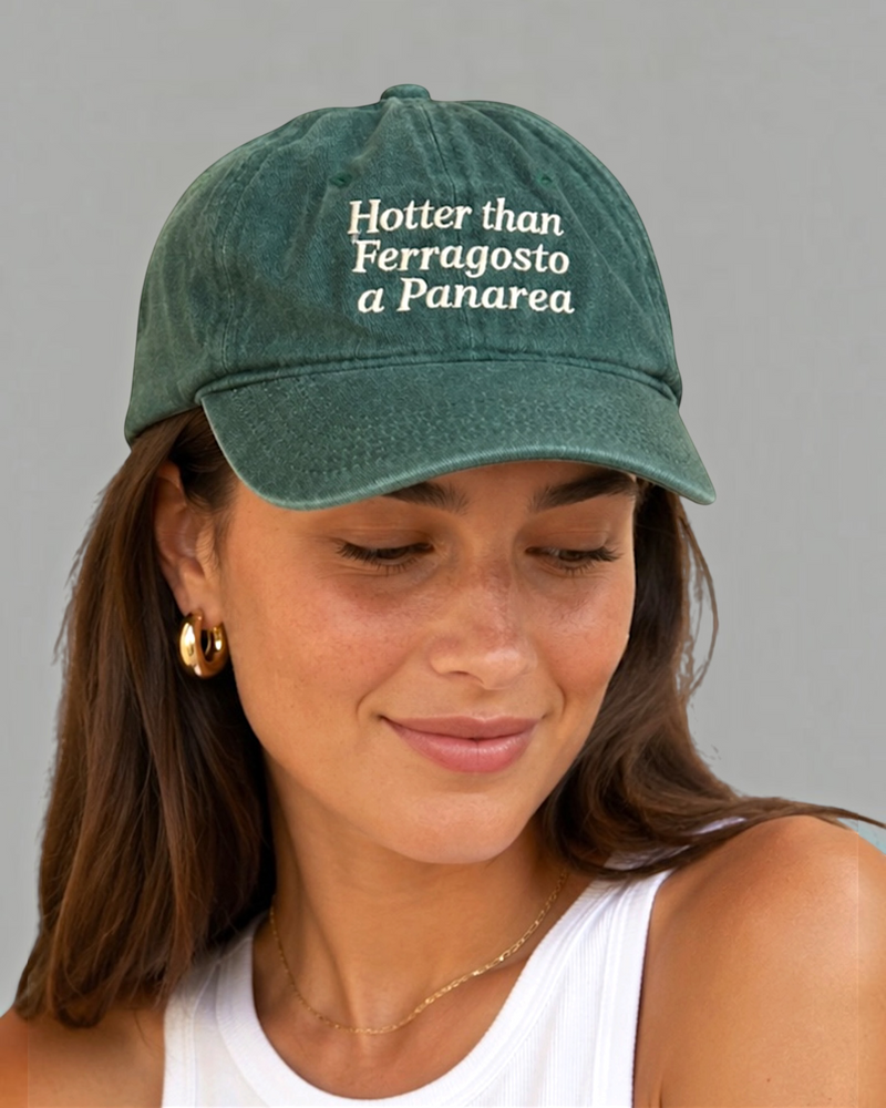 Panarea Cap in washed sage green with cream embroidery, worn by a woman